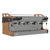 Side angle view of Borrelli luxury espresso machine with three group heads, highlighting its ergonomic design and easy-to-use control panel