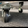 Close-up image of lockable castors on a Borrelli granite 3-door pizza prep station, ensuring easy mobility and secure placement in a commercial kitchen setting.